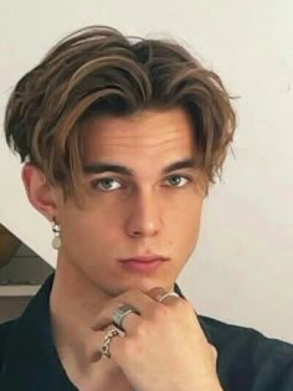 Low Taper Fade Fluffy Hair With Middle Part